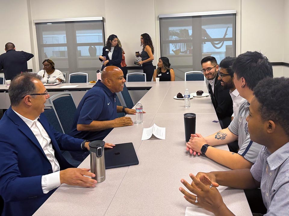 President Rochon and Provost Dabirian seated at table conversing with ASI student leaders.