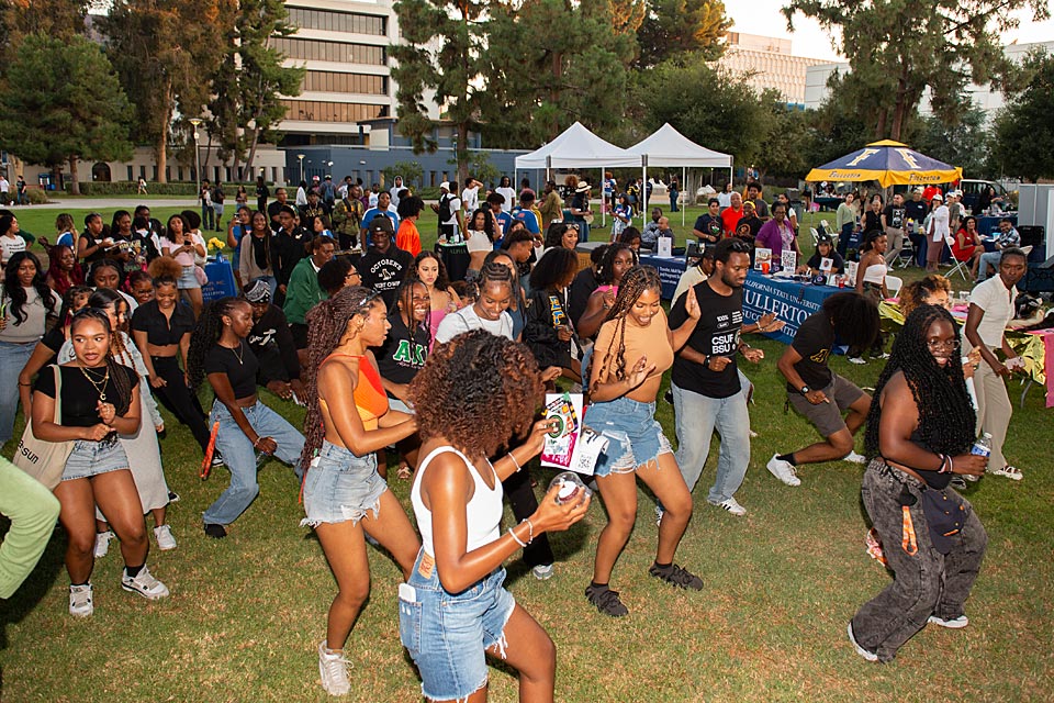 Group of black students dancing