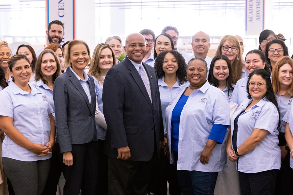 President Rochon posing with members of HRDI