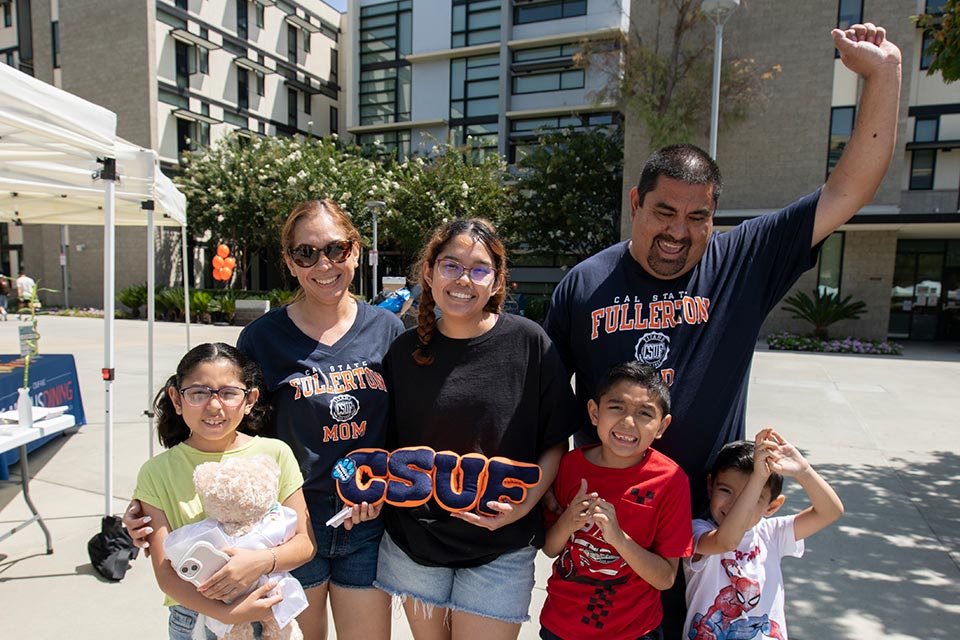 Female student and her family posing.