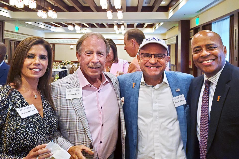 President Rochon posing with members of the Philanthropic Board.