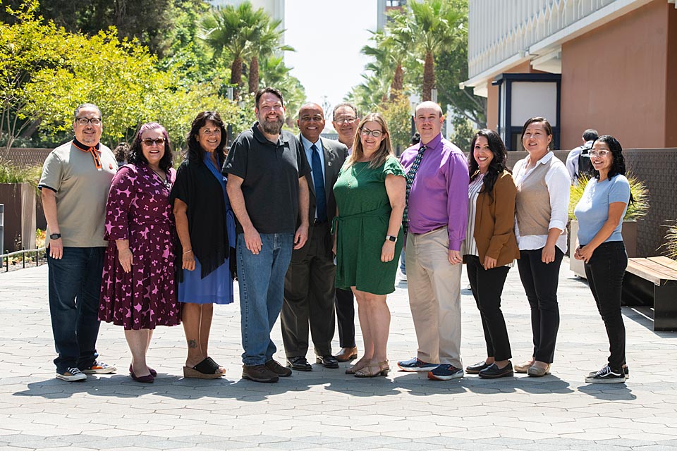 President Rochon posing with Academic Senate leadership