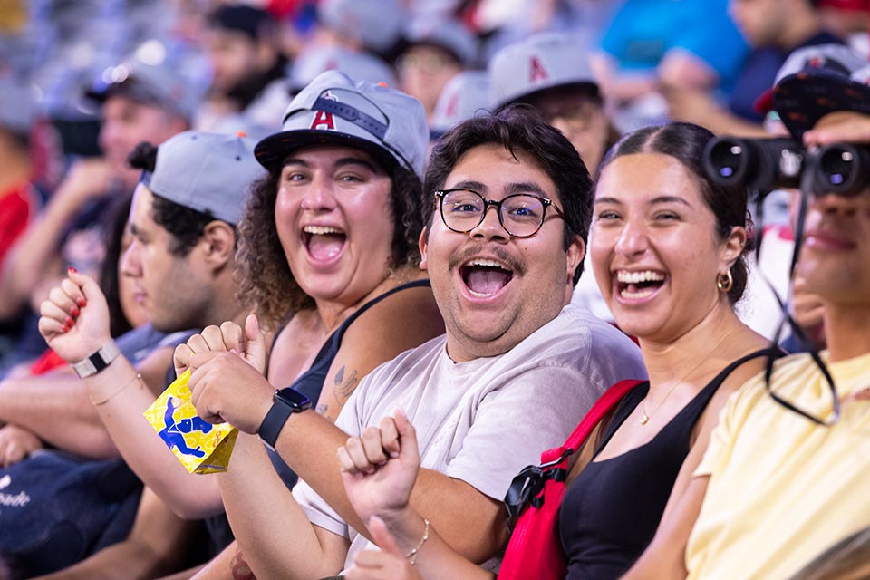 A group of fans smiling at camera