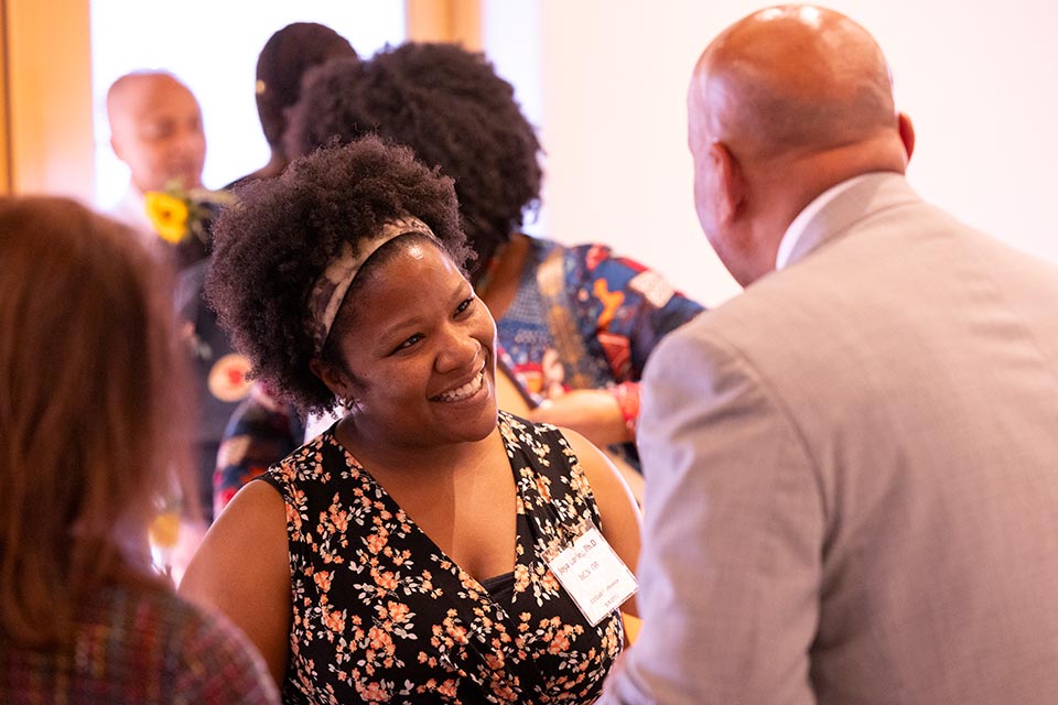 President Rochon greeting a an attendee.