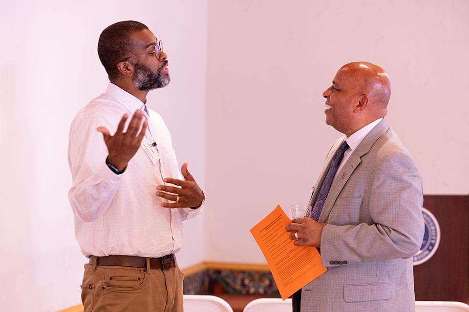 President Rochon conversing with an attendee.