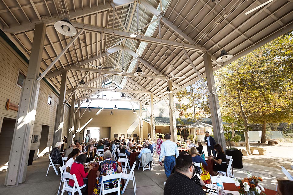 View of outdoor seating with guests eating.