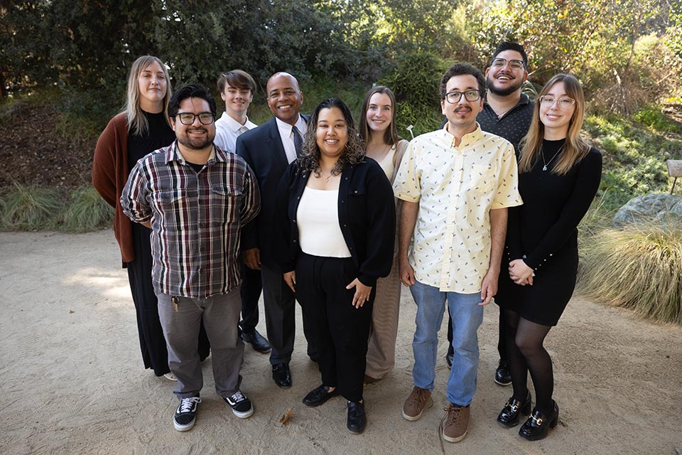 Group of student scholarship recipients posing with President Rochon