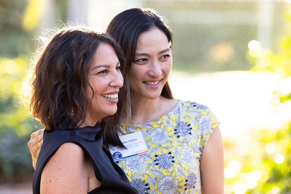 Two new faculty members posing.