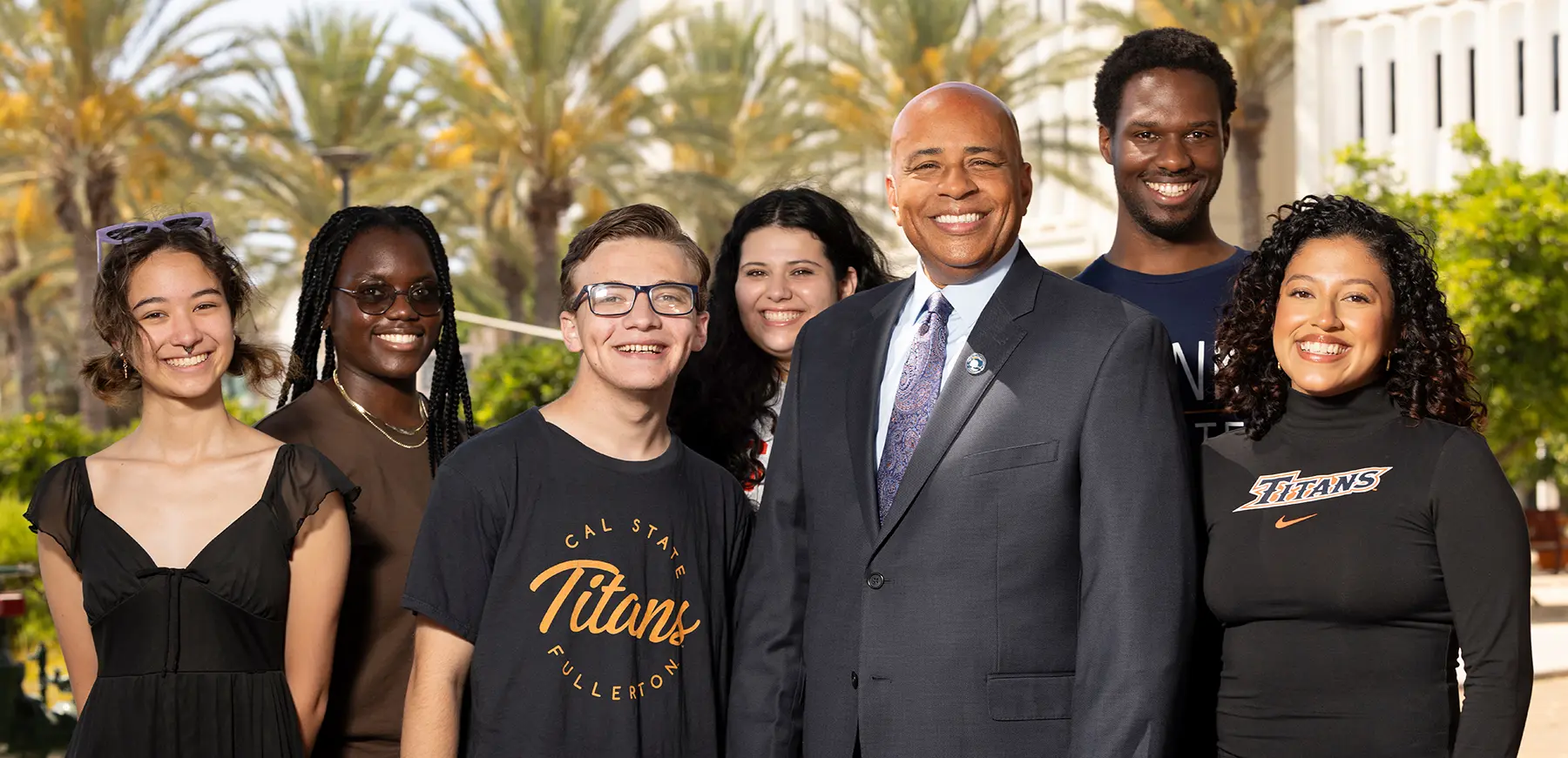 CSUF's 10th President Ronald Rochon poses with students.