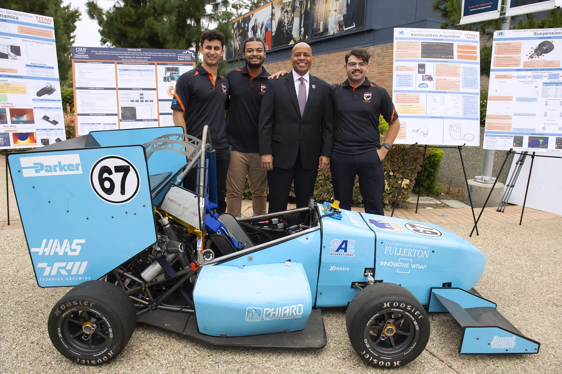 Preident Rochon with race car engineers